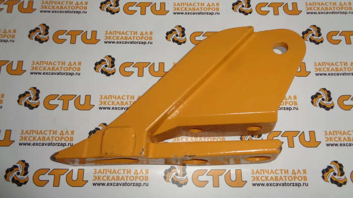 Боковой зуб 85801376 (бокорез) левый ковша экскаватора погрузчика New Holland B115
